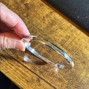Kate Spade Silver Bangle with Pink Pouch 
“Find the silver lining”